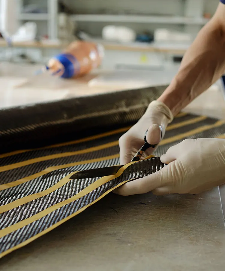 Artist's Corner - Ryan's Rugs - Photo of Ryan Miller creating a rug