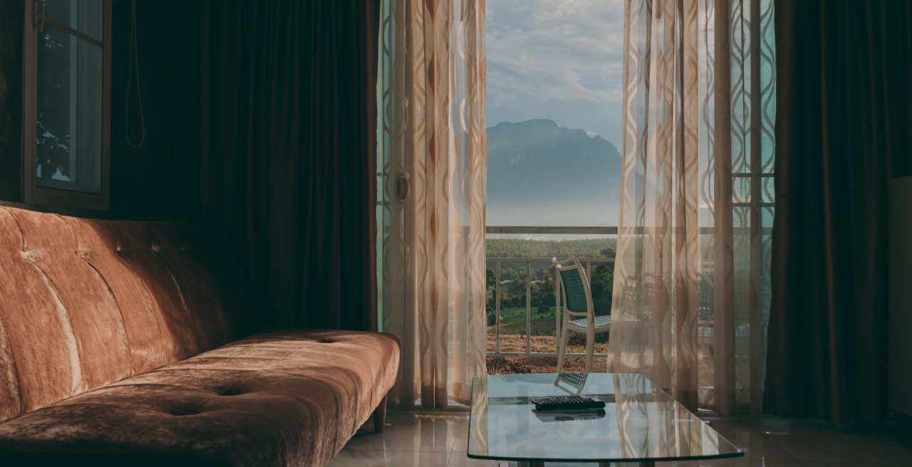 Lancaster & Associates Draperies, Shades & Homegoods - Photo of draperies in living room