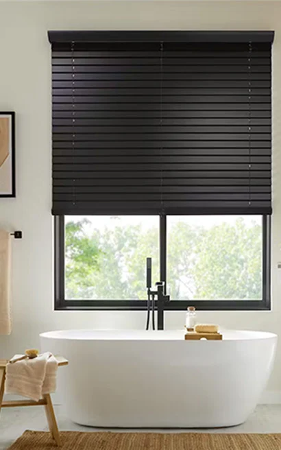 Photo of bathroom with roll and roman shades